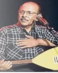 NEŞET ERTAŞ